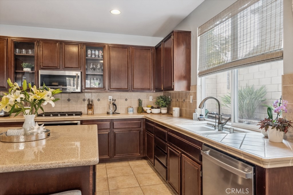 38790 Cobblestone Circle Murrieta, CA 92563 - Photo 15 of 43 a kitchen with stainless steel appliances granite countertop a sink stove and cabinets