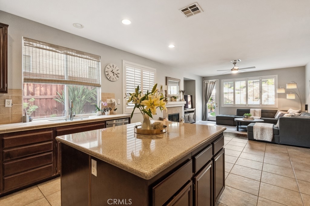38790 Cobblestone Circle Murrieta, CA 92563 - Photo 16 of 43 a kitchen with counter top space appliances and windows