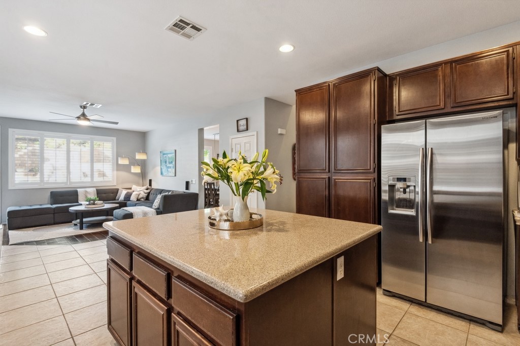 38790 Cobblestone Circle Murrieta, CA 92563 - Photo 17 of 43 a kitchen with a refrigerator and countertop