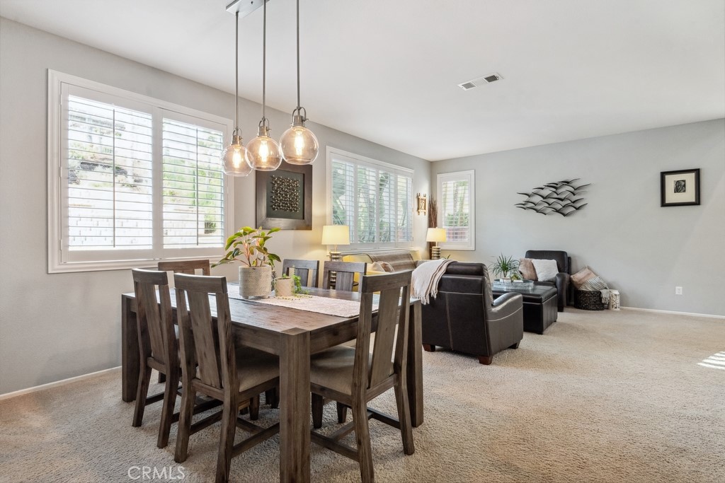 38790 Cobblestone Circle Murrieta, CA 92563 - Photo 20 of 43 a view of a dining room with furniture and window