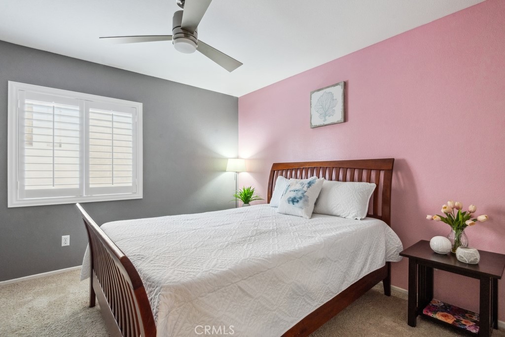 38790 Cobblestone Circle Murrieta, CA 92563 - Photo 24 of 43 a bedroom with a bed and a potted plant