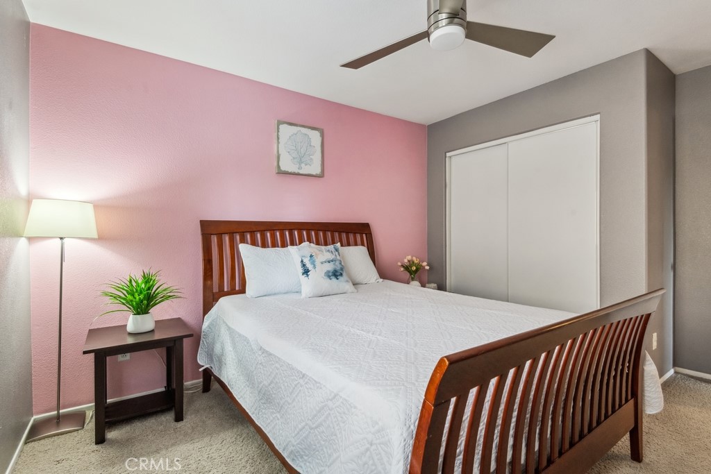 38790 Cobblestone Circle Murrieta, CA 92563 - Photo 25 of 43 a bedroom with a bed and a potted plant