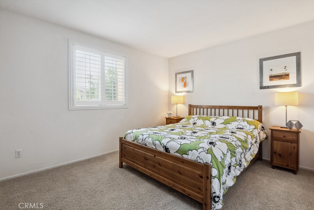 38790 Cobblestone Circle Murrieta, CA 92563 - Photo 26 of 43 a bed sitting in a bedroom next to a window