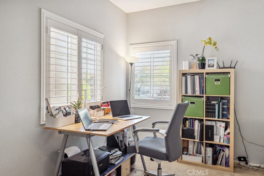 38790 Cobblestone Circle Murrieta, CA 92563 - Photo 28 of 43 a view of a workspace with furniture and a window
