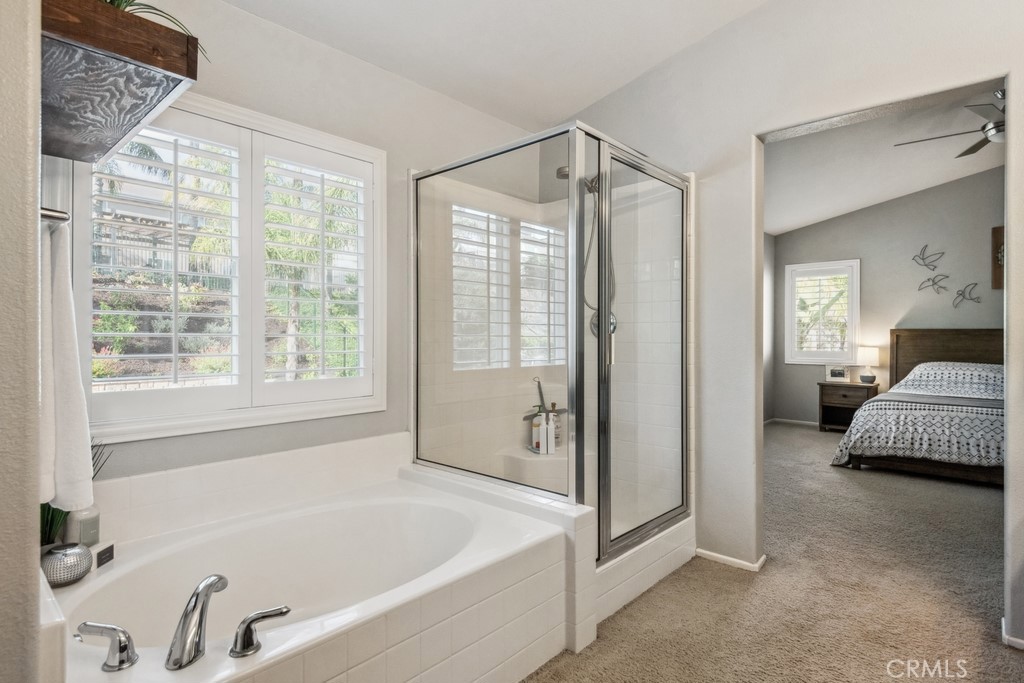 38790 Cobblestone Circle Murrieta, CA 92563 - Photo 30 of 43 a spacious bathroom with a tub shower and a sink