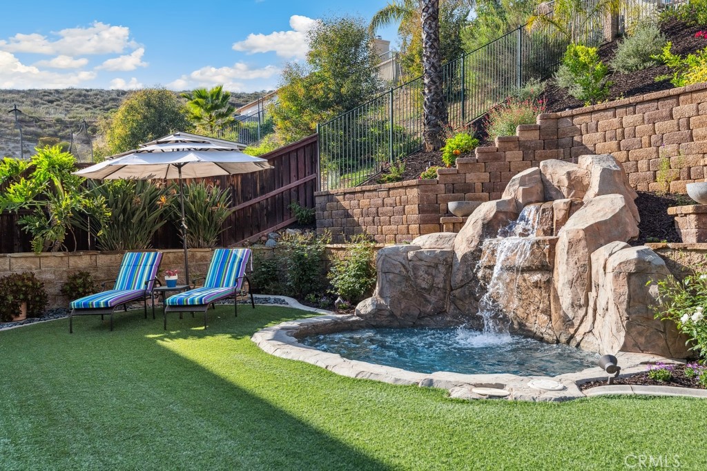 38790 Cobblestone Circle Murrieta, CA 92563 - Photo 36 of 43 a view of a house with backyard and sitting area
