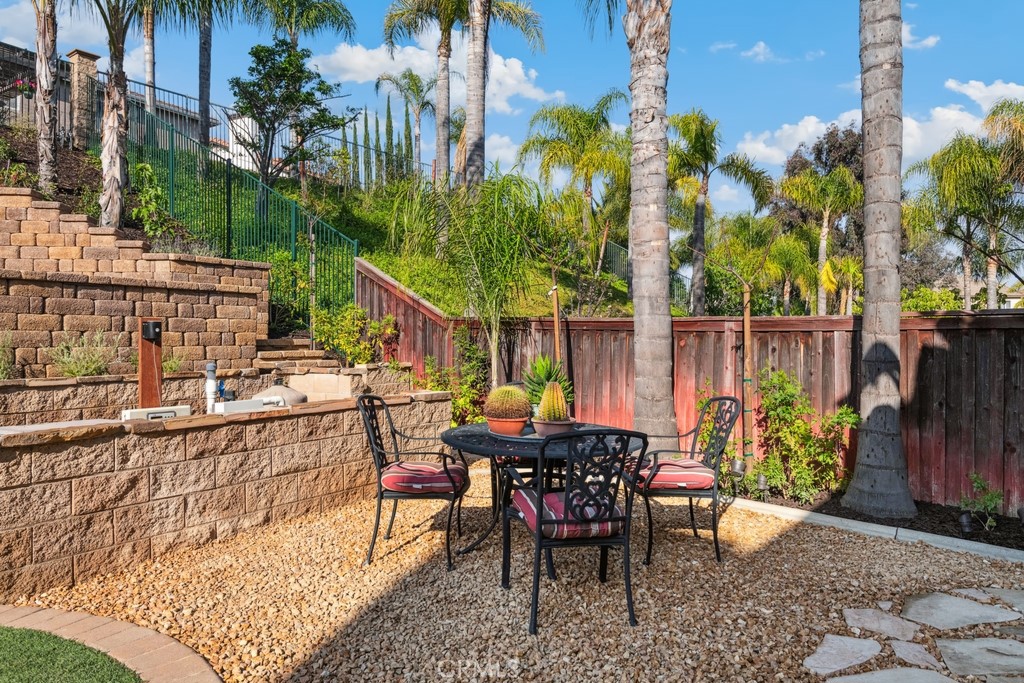 38790 Cobblestone Circle Murrieta, CA 92563 - Photo 38 of 43 a view of a chairs and table in patio with swimming pool