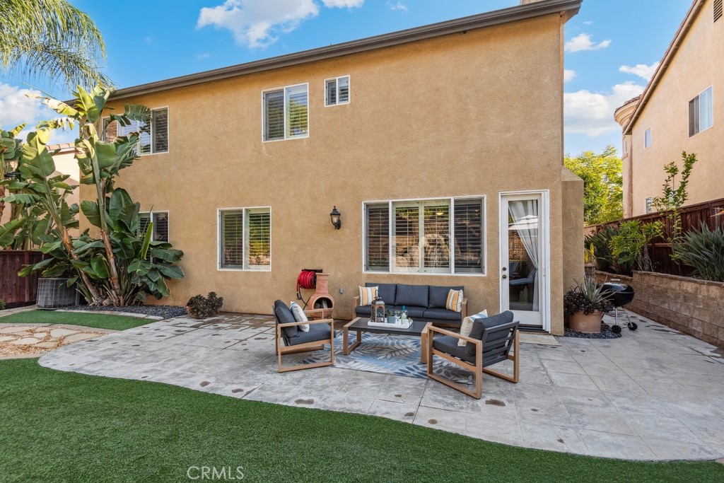 38790 Cobblestone Circle Murrieta, CA 92563 - Photo 40 of 43 a view of a house with backyard sitting area and garden