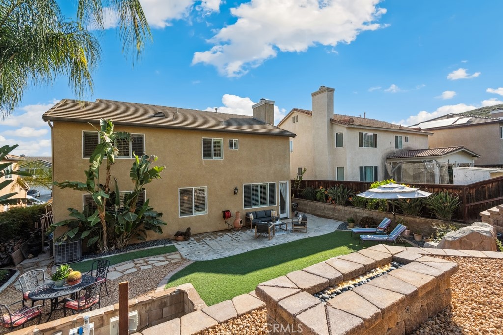 38790 Cobblestone Circle Murrieta, CA 92563 - Photo 41 of 43 a front view of house with yard outdoor seating and green space