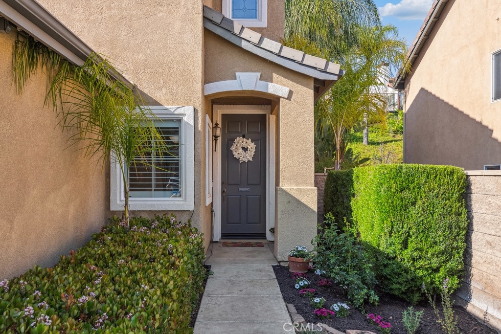 38790 Cobblestone Circle Murrieta, CA 92563 - Photo 6 of 43 a front view of a house with garden