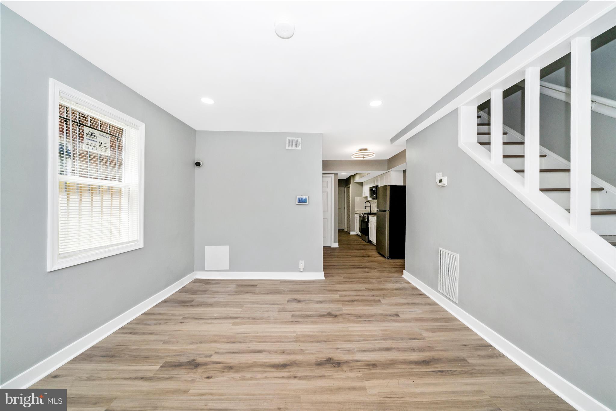5027 Benning Road Southeast Washington, DC 20019 - Photo 12 of 57 a view of a hallway with wooden floor and staircase