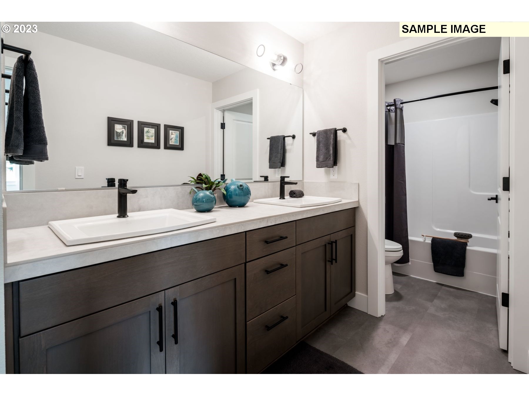 1121 South 46th Place Ridgefield, WA 98642 - Photo 18 of 18 a bathroom with a double vanity sink and mirror