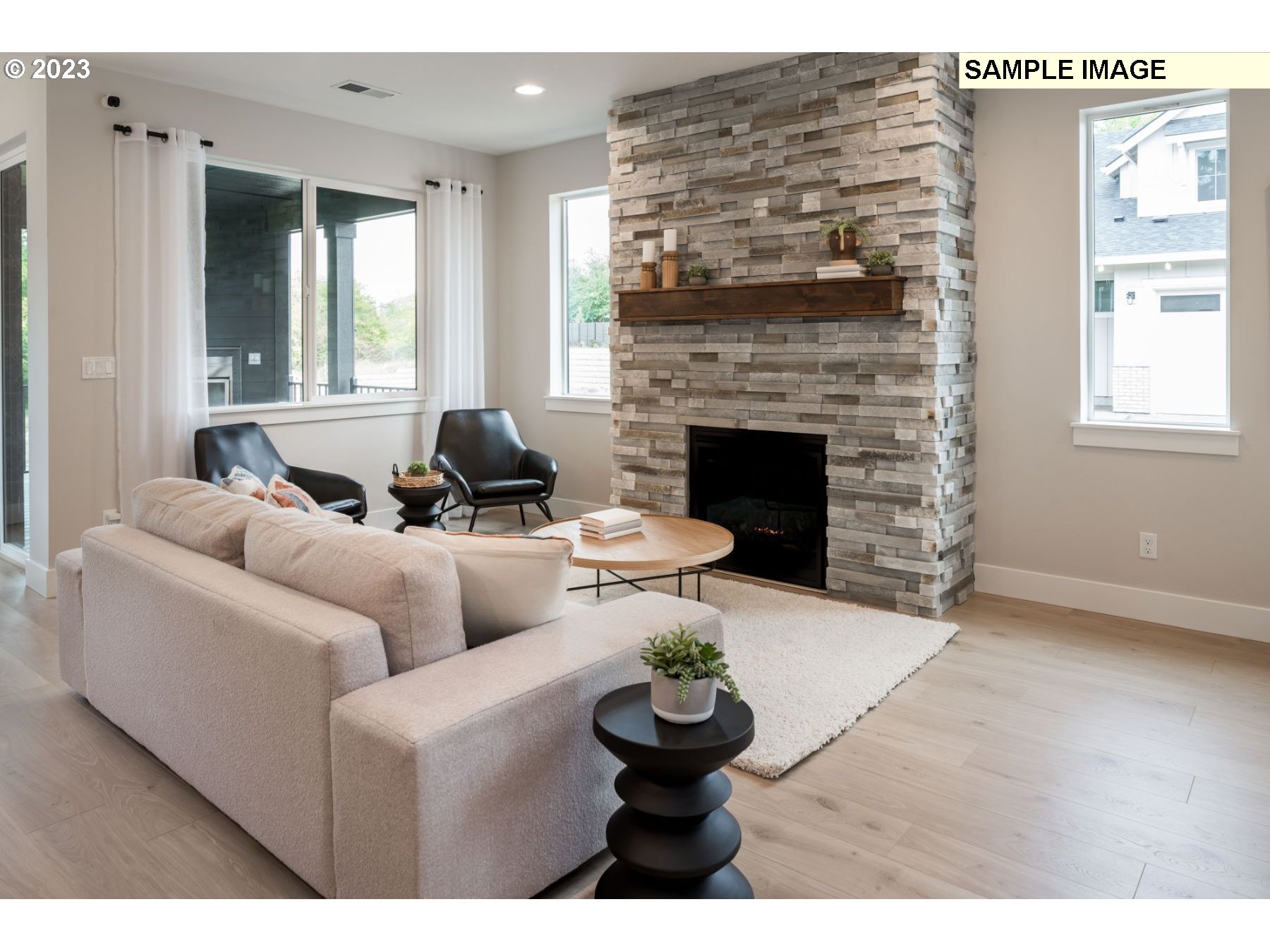 1121 South 46th Place Ridgefield, WA 98642 - Photo 6 of 18 a living room with furniture and a fireplace
