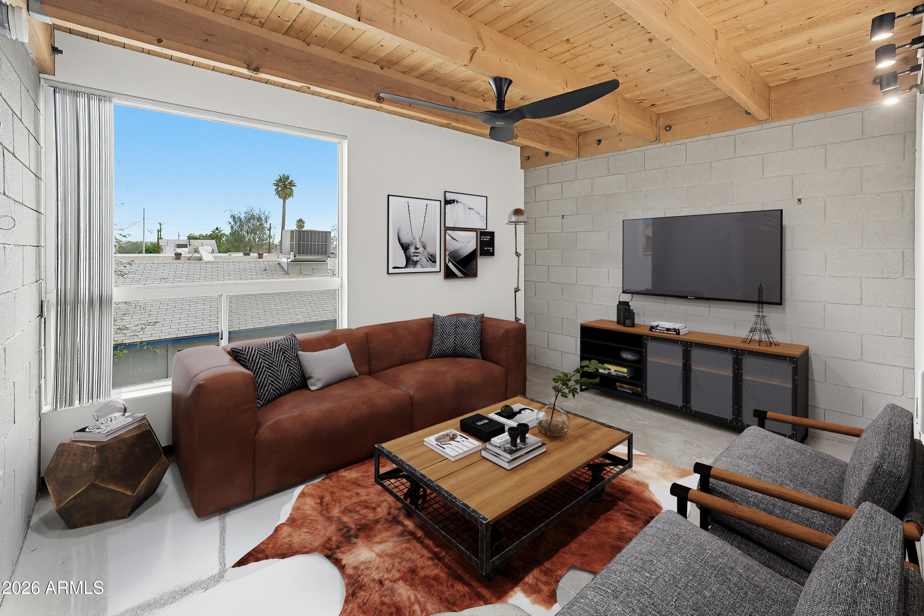 727 East Portland Street, Unit 35 Phoenix, AZ 85006 - Photo 1 of 49 a living room with furniture and a flat screen tv