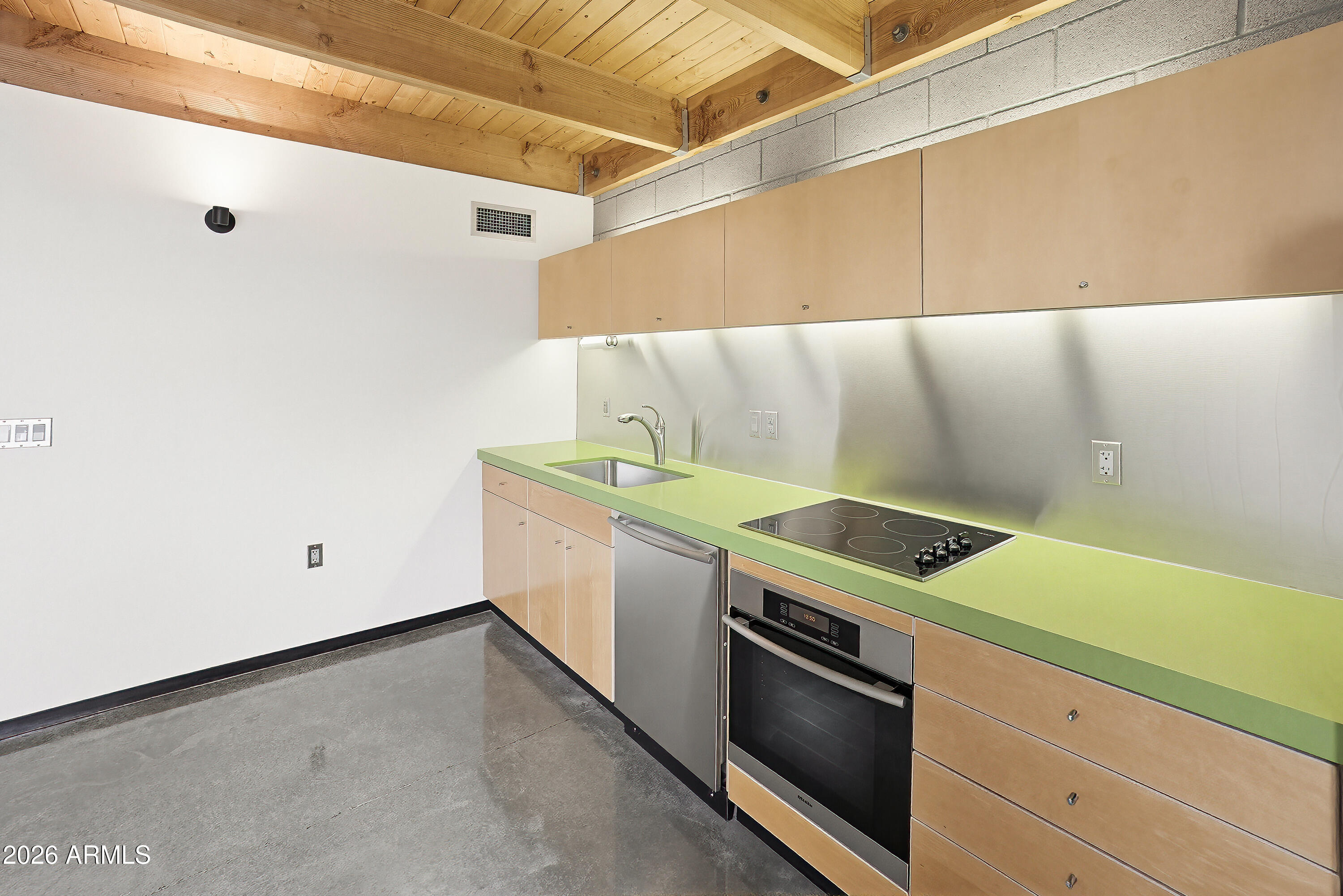 727 East Portland Street, Unit 35 Phoenix, AZ 85006 - Photo 10 of 49 a kitchen with a stove and a microwave