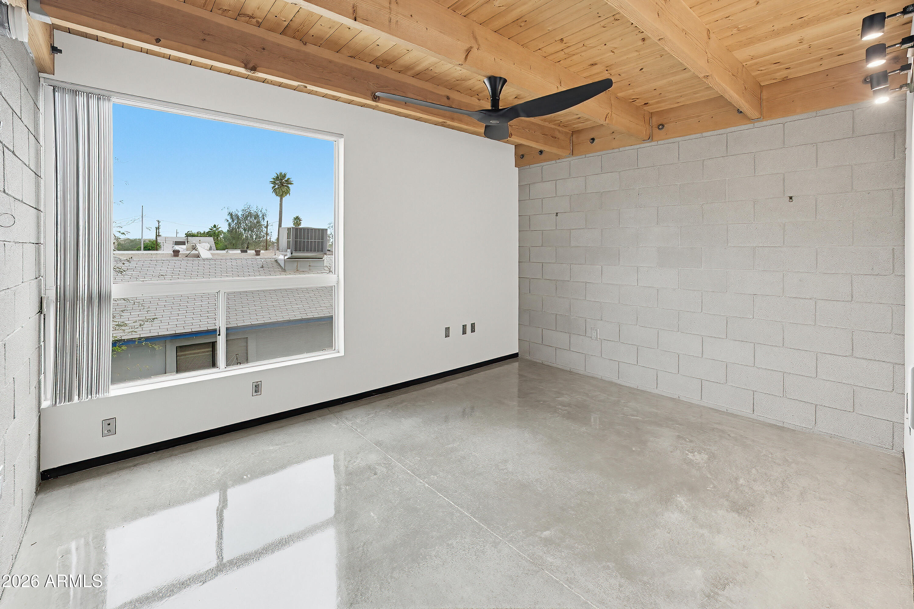 727 East Portland Street, Unit 35 Phoenix, AZ 85006 - Photo 17 of 49 a view of a big room with wooden floor and windows