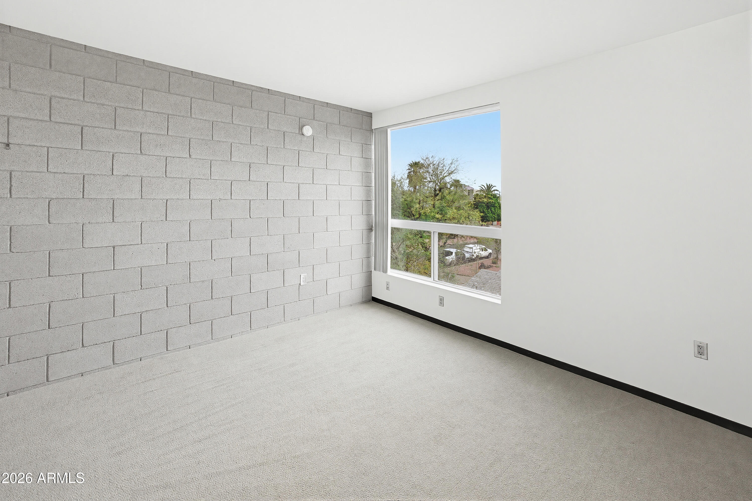 727 East Portland Street, Unit 35 Phoenix, AZ 85006 - Photo 21 of 49 a view of a small space with wooden floor and a window