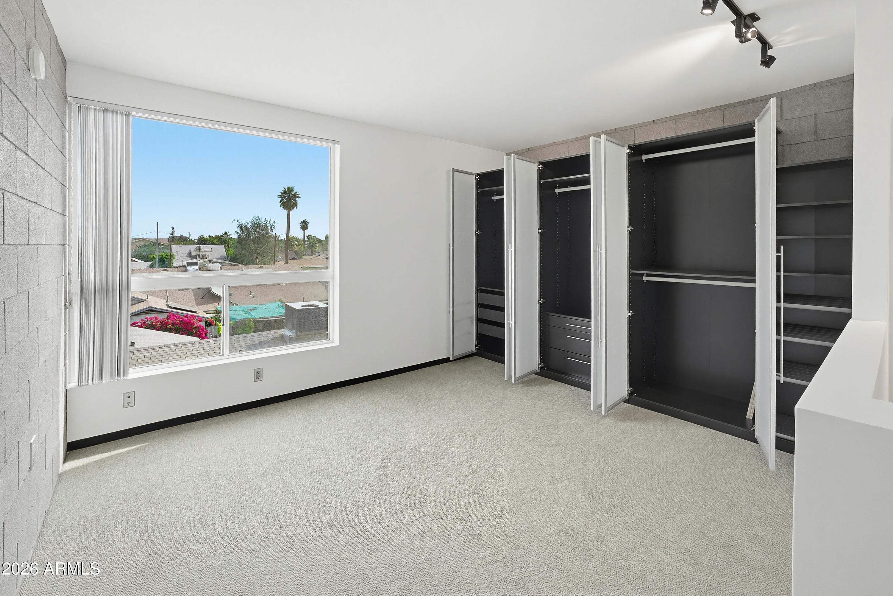 727 East Portland Street, Unit 35 Phoenix, AZ 85006 - Photo 23 of 49 a view of an empty room with a window