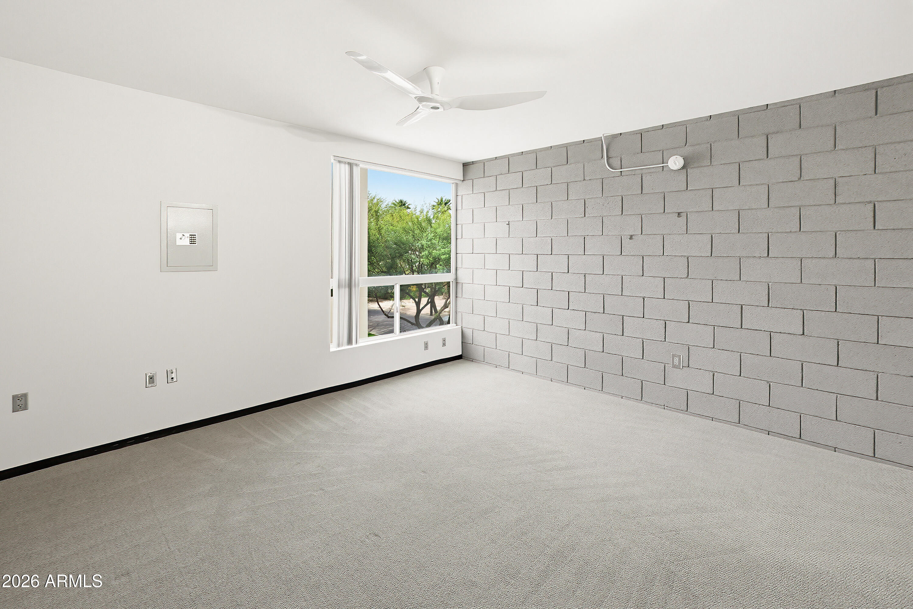 727 East Portland Street, Unit 35 Phoenix, AZ 85006 - Photo 31 of 49 a view of an empty room with a window
