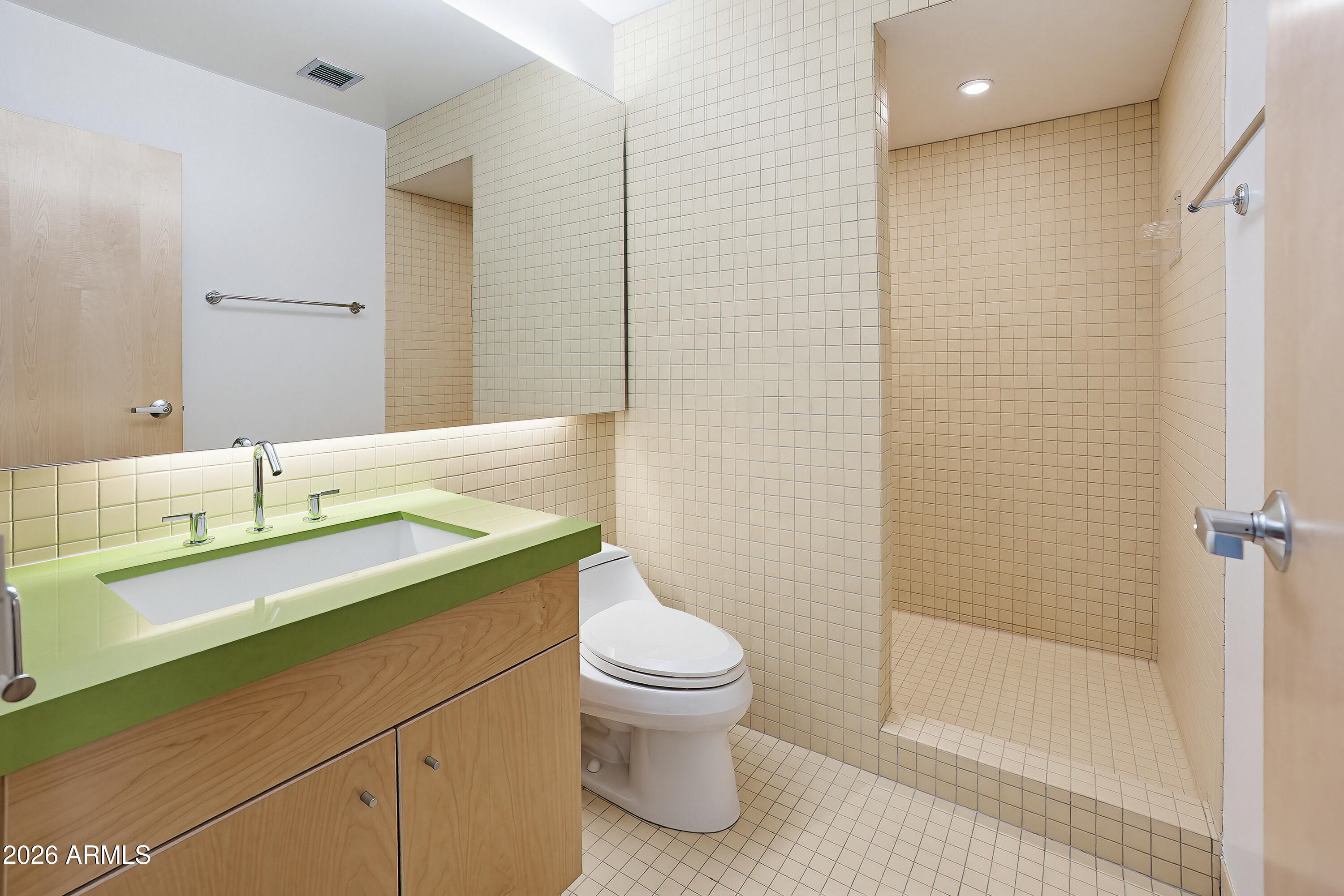727 East Portland Street, Unit 35 Phoenix, AZ 85006 - Photo 32 of 49 a bathroom with a sink a toilet and shower