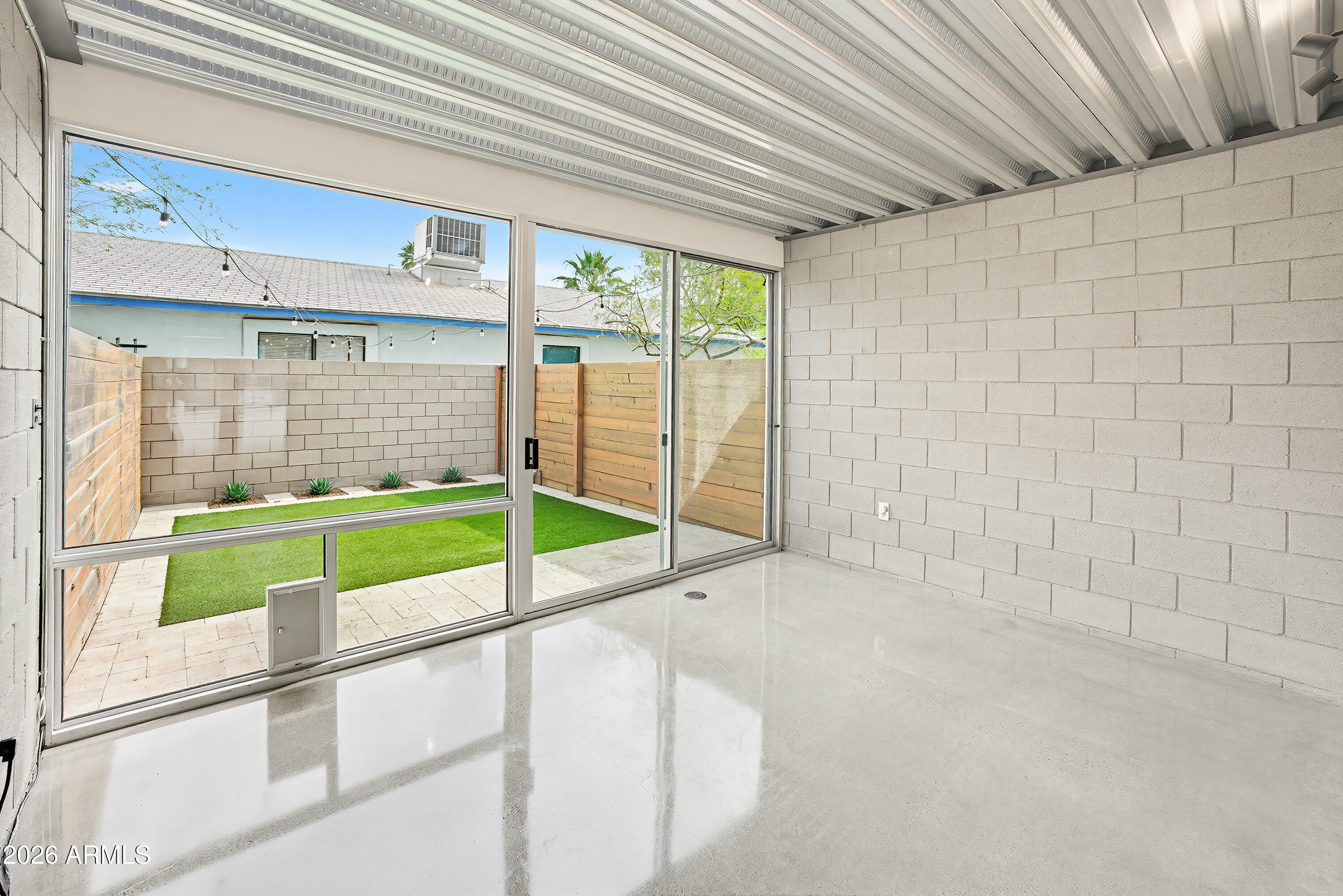 727 East Portland Street, Unit 35 Phoenix, AZ 85006 - Photo 5 of 49 a view of an empty room with a balcony