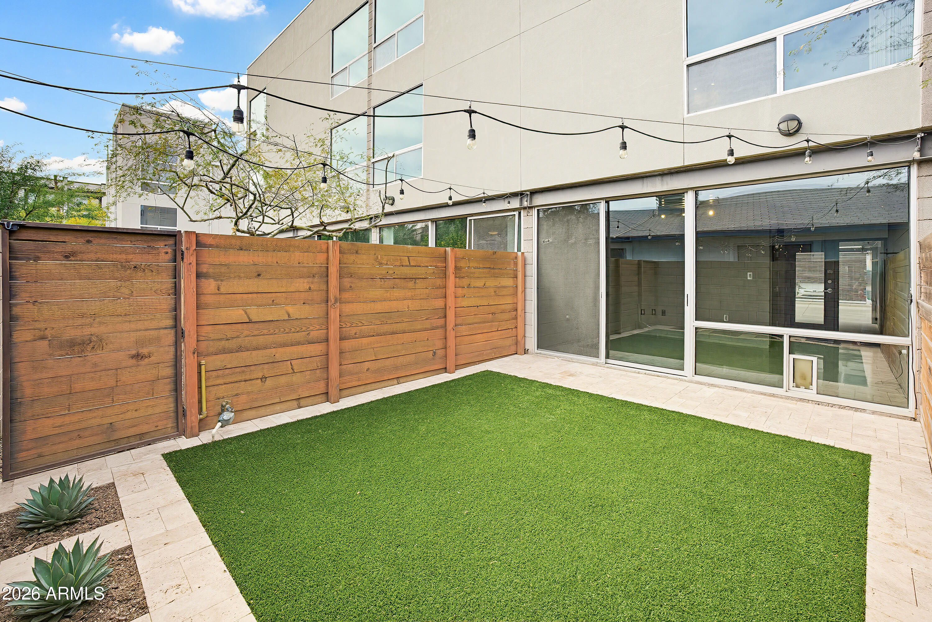 727 East Portland Street, Unit 35 Phoenix, AZ 85006 - Photo 9 of 49 a view of a backyard with wooden fence