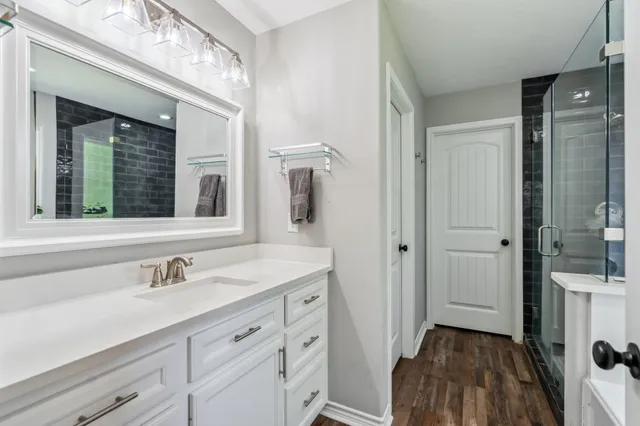a bathroom with a sink and a mirror