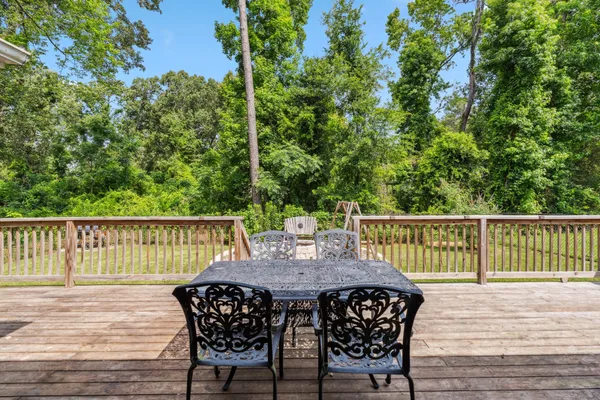 a view of balcony with furniture and wooden deck