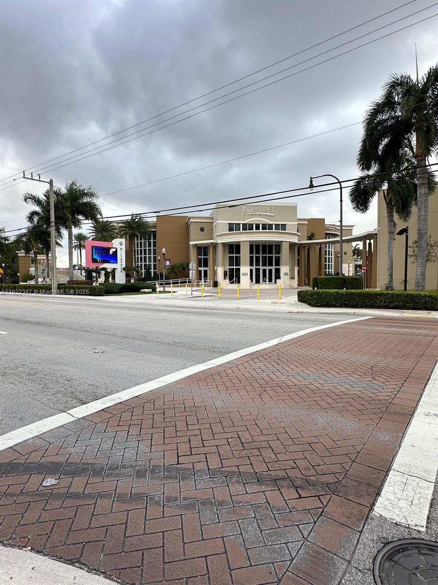 4655 Palm Avenue, Unit 203 Hialeah, FL 33012 - Photo 15 of 16 a city view with tall buildings and cars parked on road