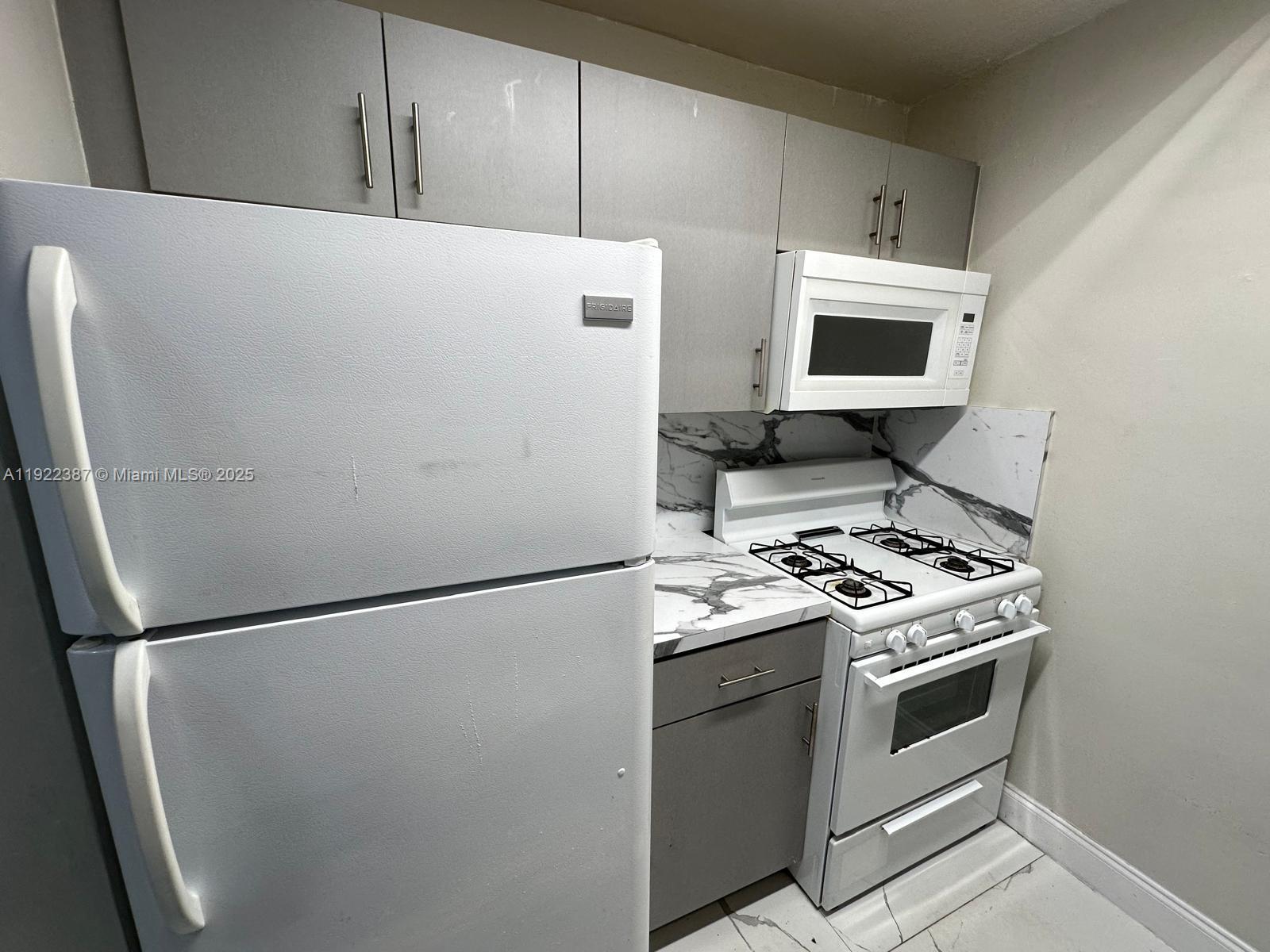 4655 Palm Avenue, Unit 203 Hialeah, FL 33012 - Photo 3 of 16 a view of kitchen and sink