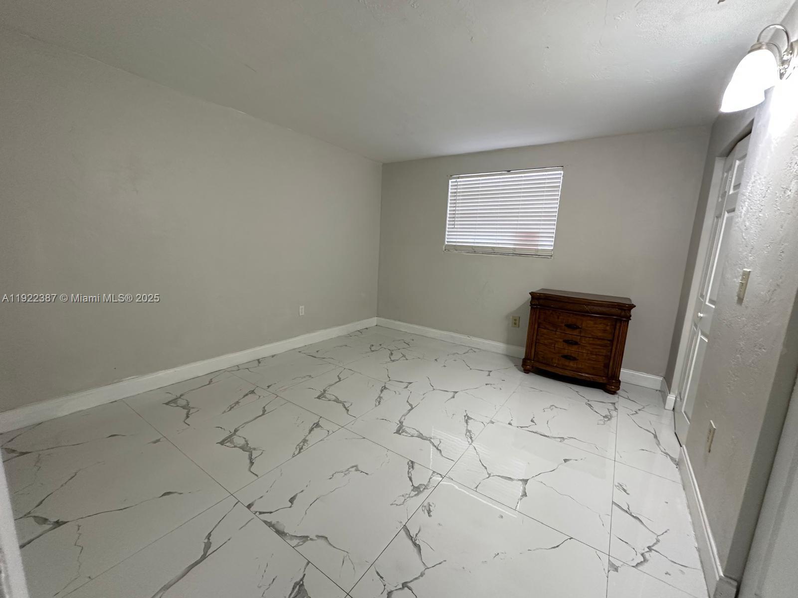 4655 Palm Avenue, Unit 203 Hialeah, FL 33012 - Photo 5 of 16 a view of room with window