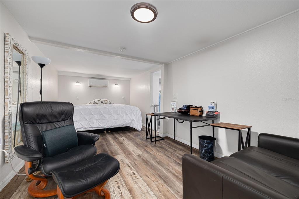 200 Broadway Dunedin, FL 34698 - Photo 17 of 59 a living room with furniture and a wooden floor