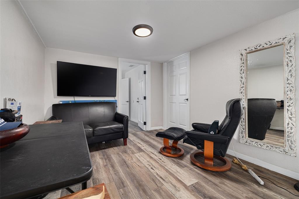 200 Broadway Dunedin, FL 34698 - Photo 18 of 59 a living room with furniture and a flat screen tv