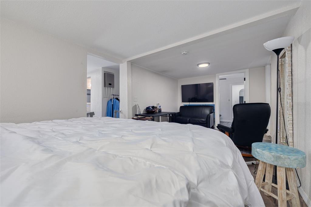 200 Broadway Dunedin, FL 34698 - Photo 20 of 59 a bed room with a bed window and chair