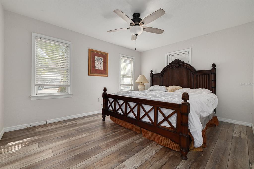 200 Broadway Dunedin, FL 34698 - Photo 22 of 59 a bed sitting in a bedroom next to a window