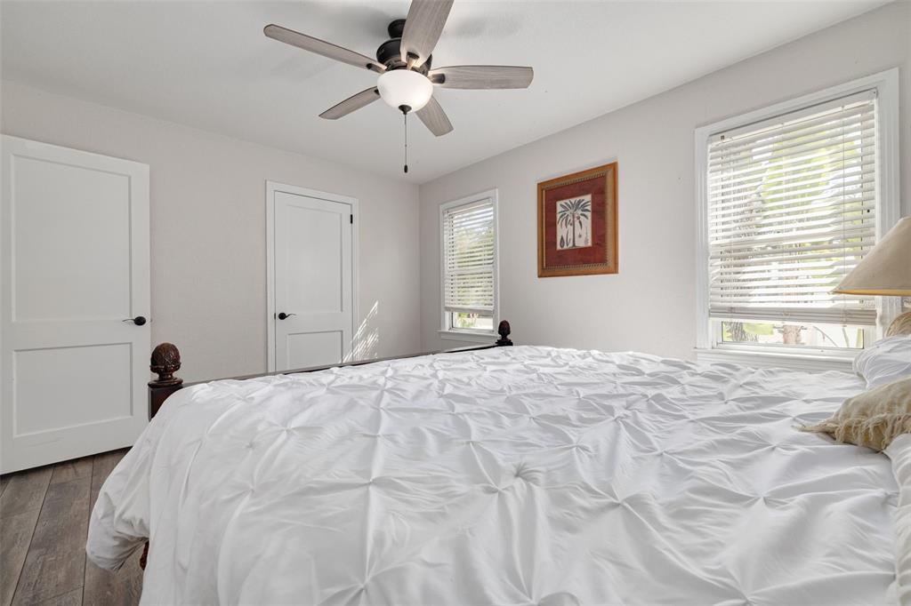 200 Broadway Dunedin, FL 34698 - Photo 23 of 59 a bedroom with a large bed and a window