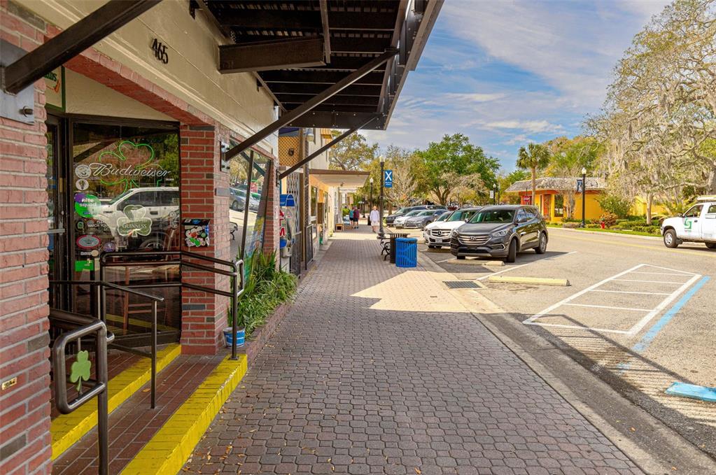 200 Broadway Dunedin, FL 34698 - Photo 45 of 59 a view of a patio with a table and chairs