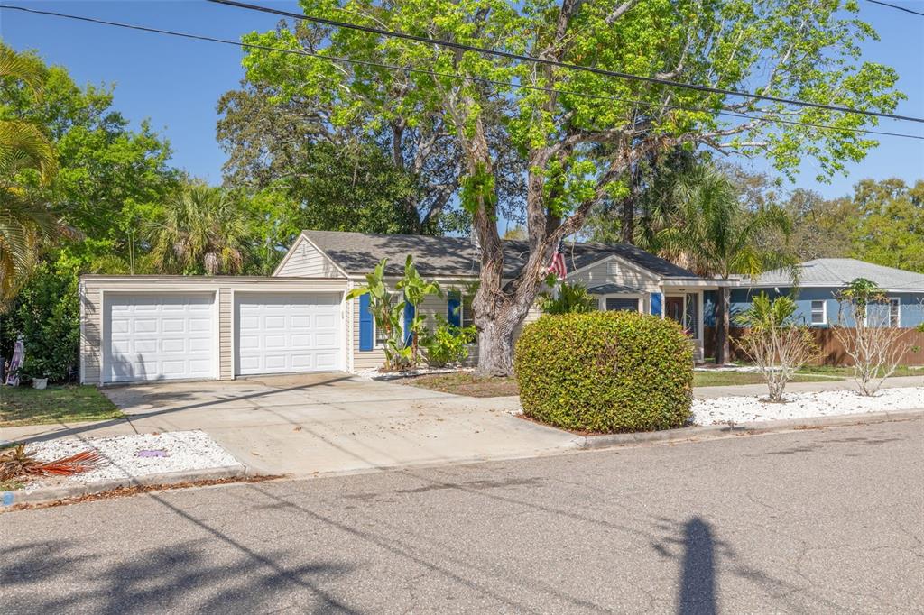 200 Broadway Dunedin, FL 34698 - Photo 6 of 59 a view of a house with a street and a tree