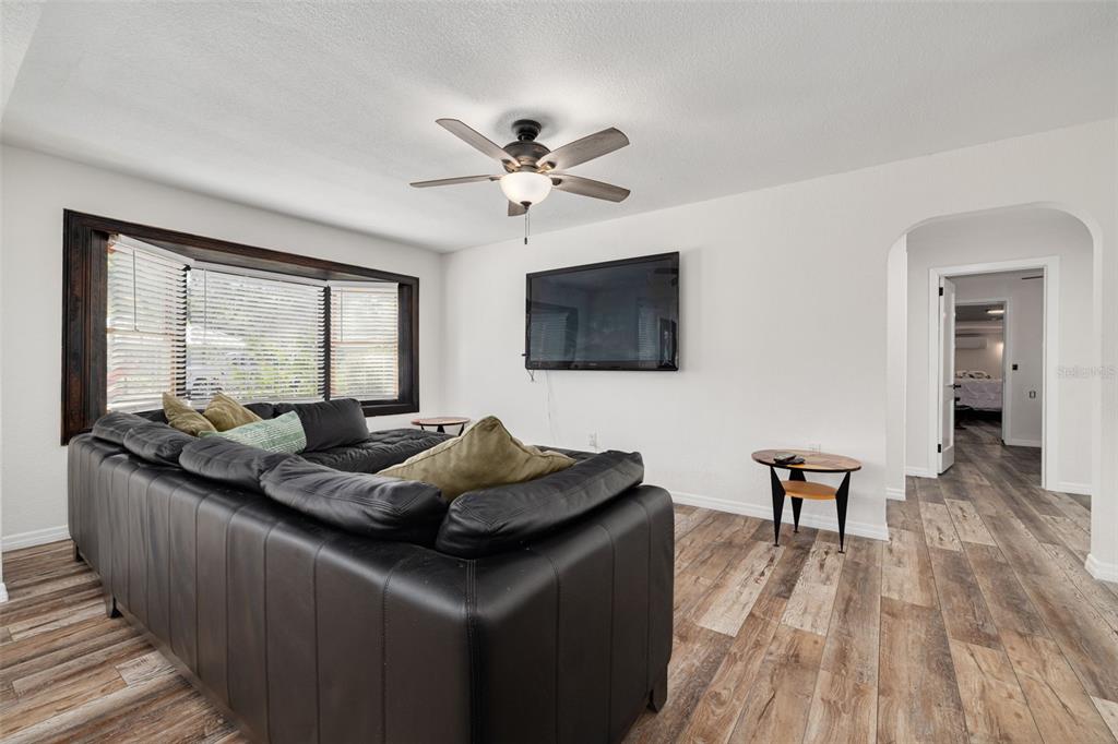 200 Broadway Dunedin, FL 34698 - Photo 9 of 59 a living room with furniture and a flat screen tv