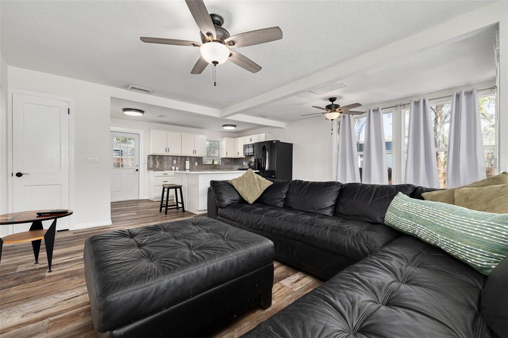 200 Broadway Dunedin, FL 34698 - Photo 10 of 59 a living room with furniture and a chandelier