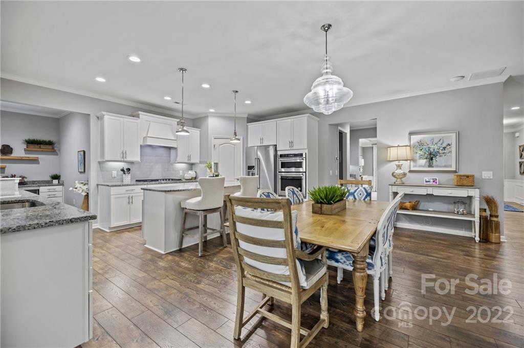 270 Hampton Trail Drive Fort Mill, SC 29708 - Photo 15 of 42 a view of a dining room with furniture kitchen and chandelier