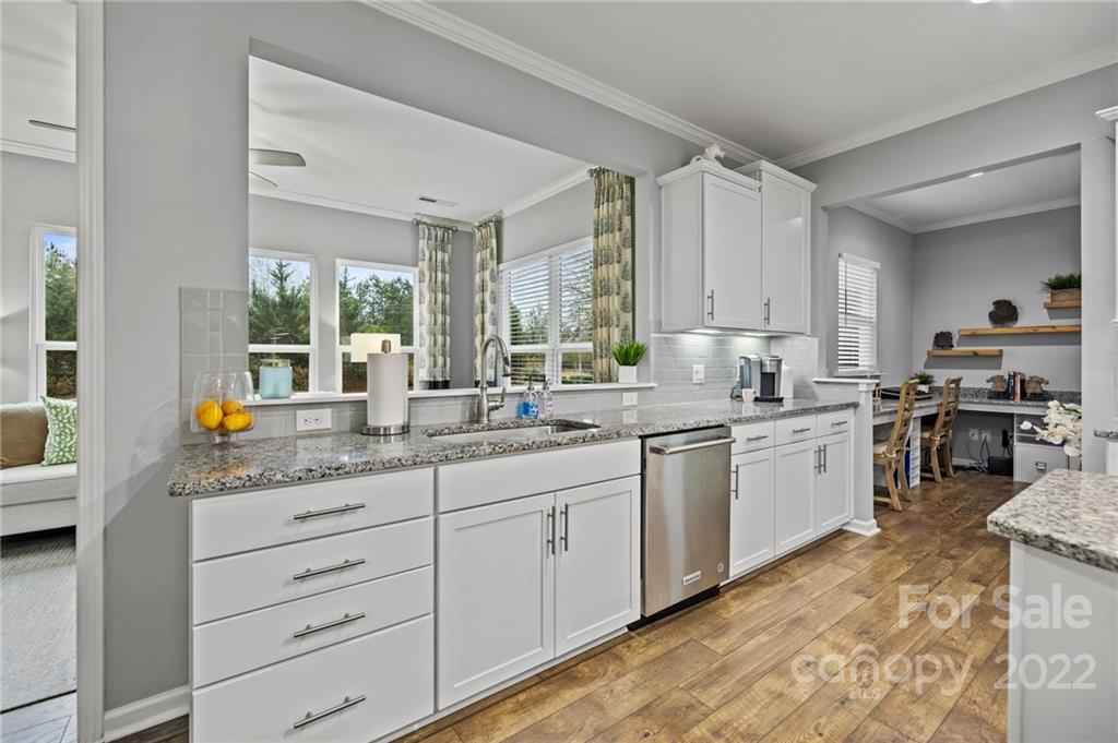 270 Hampton Trail Drive Fort Mill, SC 29708 - Photo 17 of 42 a kitchen with granite countertop white cabinets sink and stainless steel appliances