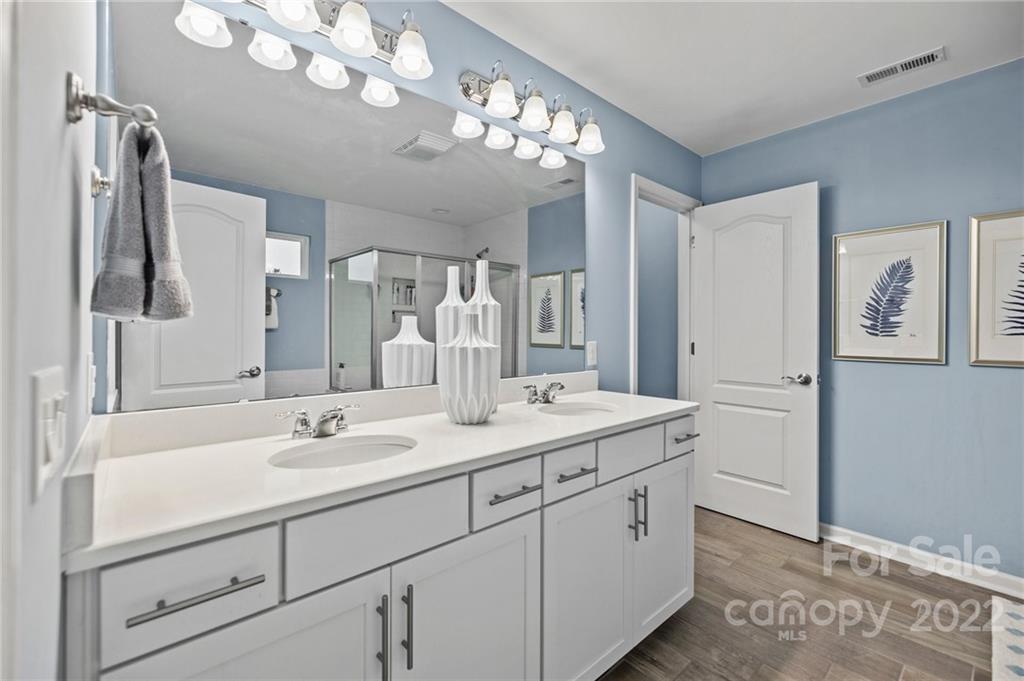 270 Hampton Trail Drive Fort Mill, SC 29708 - Photo 35 of 42 a bathroom with a sink a large mirror and a shower