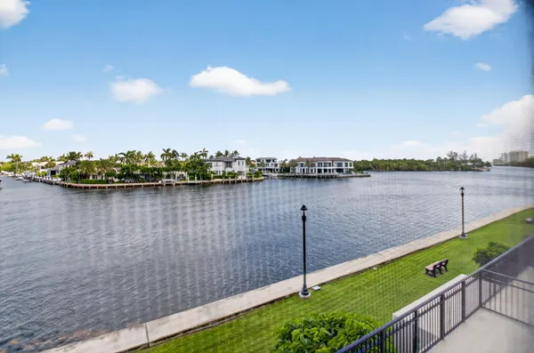 an aerial view of a house with outdoor space and lake view