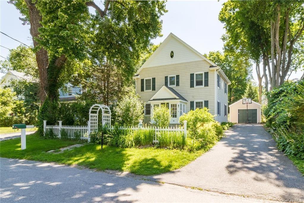 34 Anderson Road Katonah, NY 10536 - Photo 1 of 1 a front view of a house with a yard and potted plants