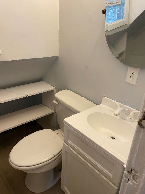 1340 East 76th Street, Unit 2 Chicago, IL 60619 - Photo 7 of 10 a bathroom with a sink and a toilet