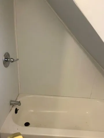 a bathroom with a bath tub