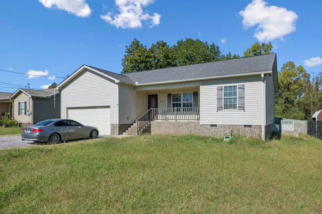 a view of house with yard and entertaining space