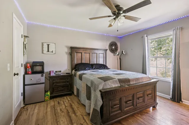 a bedroom with a bed and a chandelier