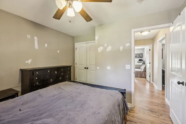 a bedroom with a bed and a chandelier